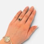 A beautiful simple ring with a teardrop-shaped black stone. The ring has fine carvings that surround the stone in the finest way.