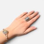 Beautiful silver ring with a braided look and a beautiful round stone in the middle.