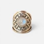 Beautiful silver ring with a braided look and a beautiful round stone in the middle.