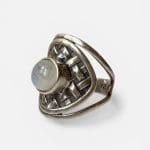 Beautiful silver ring with a braided look and a beautiful round stone in the middle.