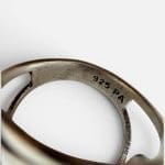 Beautiful silver ring with a braided look and a beautiful round stone in the middle.