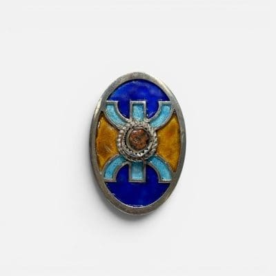 Silver ring in blue and yellow enamel, handmade in Morocco. Reddish stone in the center.