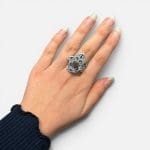 Beautiful Fatima ring with a reddish stone in the middle. Fine enamel details in yellow, green and blue. Silver carvings.