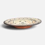 Black ceramic plate with yellow pattern handmade in Morocco. Measures 26 cm.