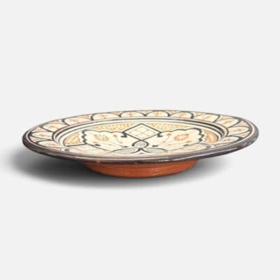 Black ceramic plate with yellow pattern handmade in Morocco. Measures 26 cm.