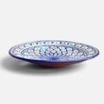 Blue dish with colored pattern and details in light blue, red and yellow, measuring 42 cm, handmade in Morocco.