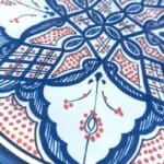 Blue dish with colored pattern and details in orange, measuring 42 cm, handmade in Morocco.