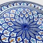 Blue dish with colored pattern and details in light blue, red and yellow, measuring 42 cm, handmade in Morocco.